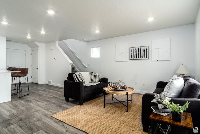 3440 W Mitchell Dr, Lehi, UT 84043 - living area with baseboards, recessed lighting, wood finished floors, and stairway