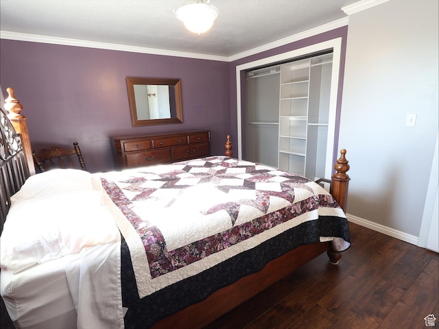 bedroom featuring dark wood-type flooring, a closet, crown molding, and baseboards