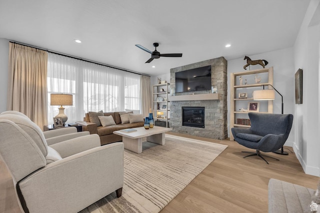 2119 N 520 W, Centerville, UT 84014 - living area featuring a fireplace, a ceiling fan, recessed lighting, and light wood-style flooring