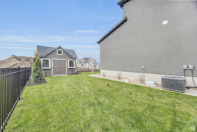 2119 N 520 W, Centerville, UT 84014 - view of yard featuring central AC, fence, an outbuilding, and a shed
