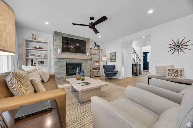 2119 N 520 W, Centerville, UT 84014 - living area with light wood finished floors, a stone fireplace, a ceiling fan, recessed lighting, and stairway