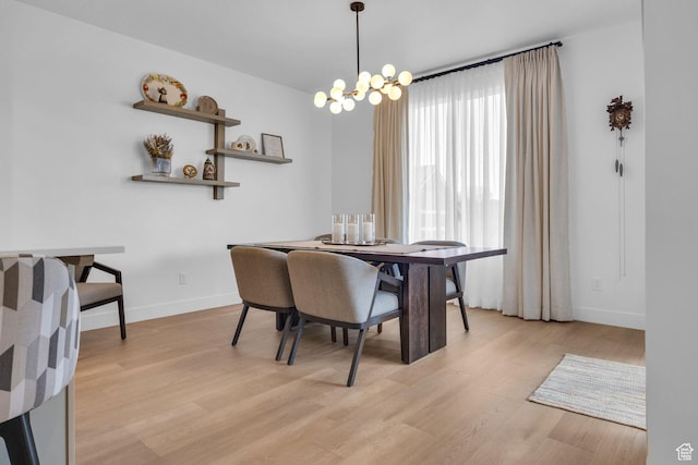 2119 N 520 W, Centerville, UT 84014 - dining space with baseboards, a chandelier, and light wood finished floors