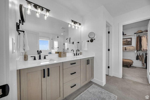 2119 N 520 W, Centerville, UT 84014 - bathroom featuring double vanity, a sink, baseboards, and a shower