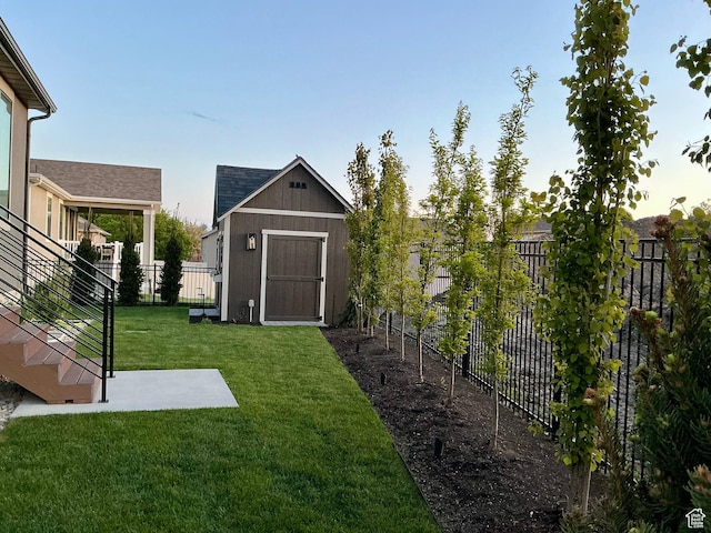 2119 N 520 W, Centerville, UT 84014 - view of yard featuring a fenced backyard, an outbuilding, a storage shed, and stairway