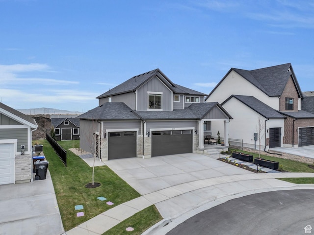 2119 N 520 W, Centerville, UT 84014 - view of front of property with fence, an attached garage, board and batten siding, a front yard, and driveway