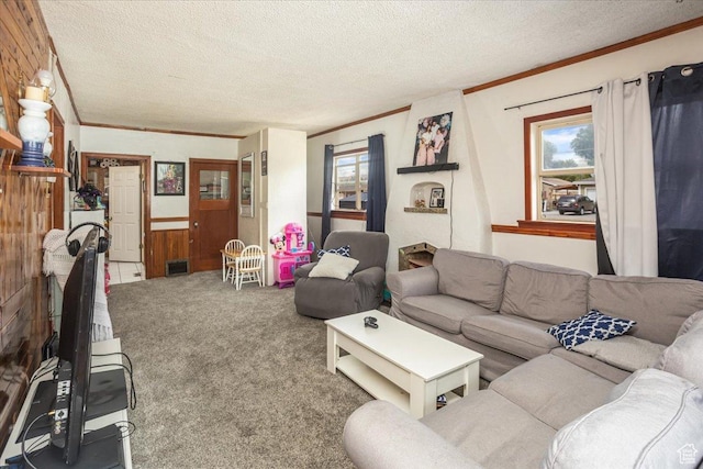 67 N 200 E, Tremonton, UT 84337 - carpeted living area with a wealth of natural light, visible vents, crown molding, and a textured ceiling