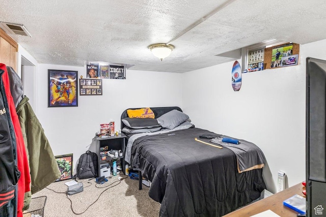 67 N 200 E, Tremonton, UT 84337 - carpeted bedroom featuring visible vents and a textured ceiling