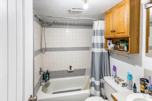 67 N 200 E, Tremonton, UT 84337 - full bath with vanity, shower / tub combo with curtain, toilet, a textured ceiling, and visible vents