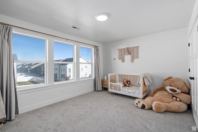 unfurnished room with baseboards, visible vents, and carpet floors