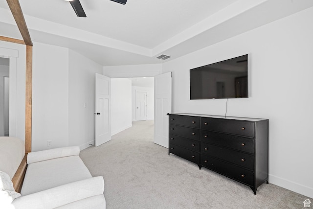 living room with baseboards, ceiling fan, visible vents, and light carpet