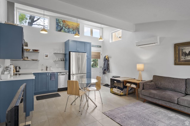 67 W 300 S, Kanab, UT 84741 - kitchen with blue cabinetry, appliances with stainless steel finishes, an AC wall unit, and open shelves