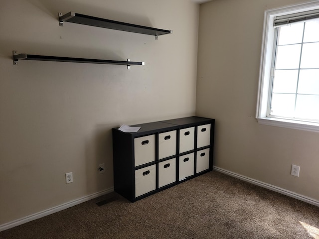 949 N University Ave Unit 19, Provo, UT 84604 - unfurnished bedroom featuring baseboards and dark carpet
