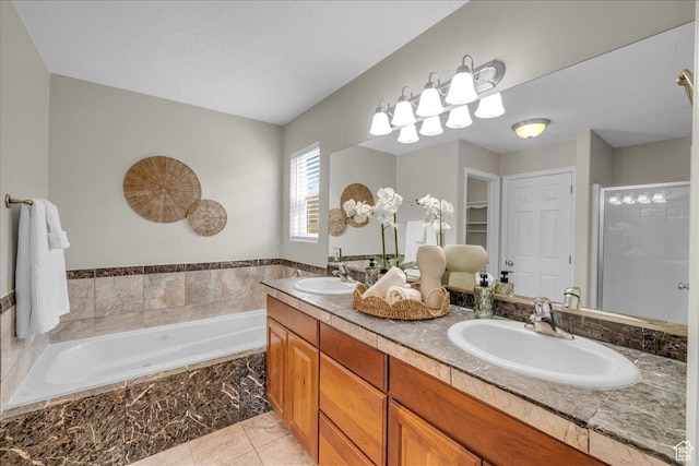 2367 N Monarch Cir E, Cedar City, UT 84721 - bathroom featuring a bath, double vanity, a shower stall, and tile patterned floors
