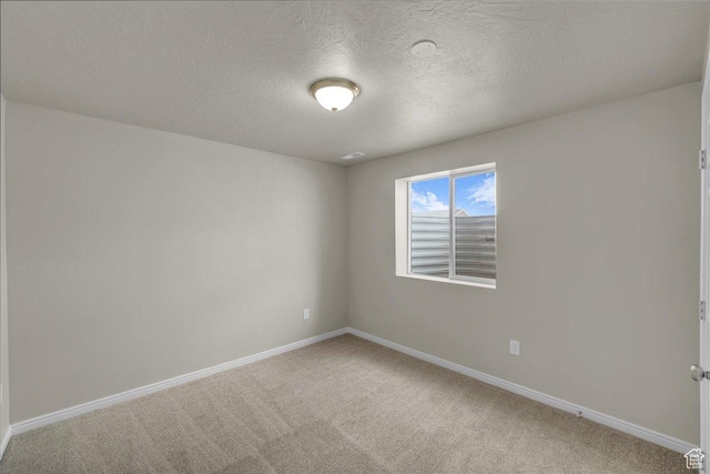 2367 N Monarch Cir E, Cedar City, UT 84721 - unfurnished room with light carpet, baseboards, and a textured ceiling
