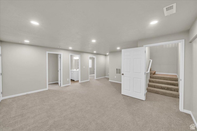 2367 N Monarch Cir E, Cedar City, UT 84721 - finished below grade area featuring light colored carpet, recessed lighting, baseboards, and stairs