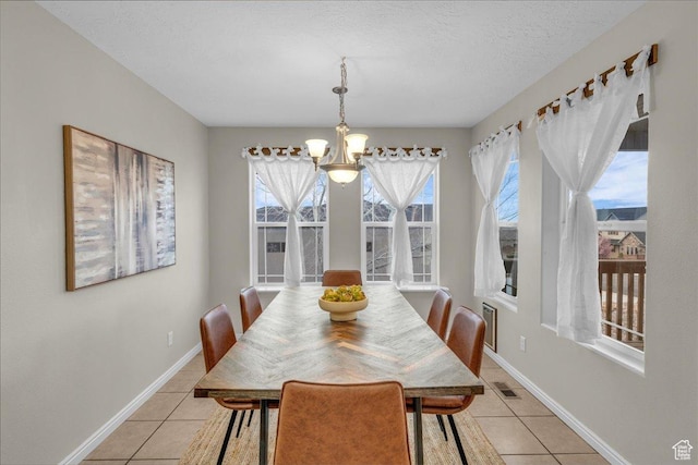 2367 N Monarch Cir E, Cedar City, UT 84721 - dining space featuring a chandelier, light tile patterned flooring, and healthy amount of natural light