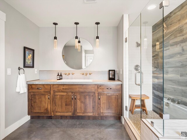 129 S 7200 E, Huntsville, UT 84317 - bathroom featuring visible vents, baseboards, concrete flooring, vanity, and a stall shower