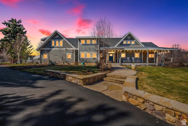 view of front of house featuring a front yard and a porch