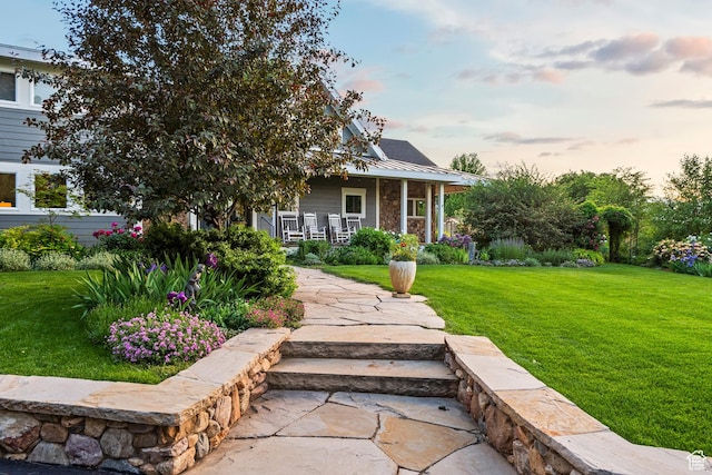 129 S 7200 E, Huntsville, UT 84317 - view of front facade with covered porch, a front yard, and a metal roof