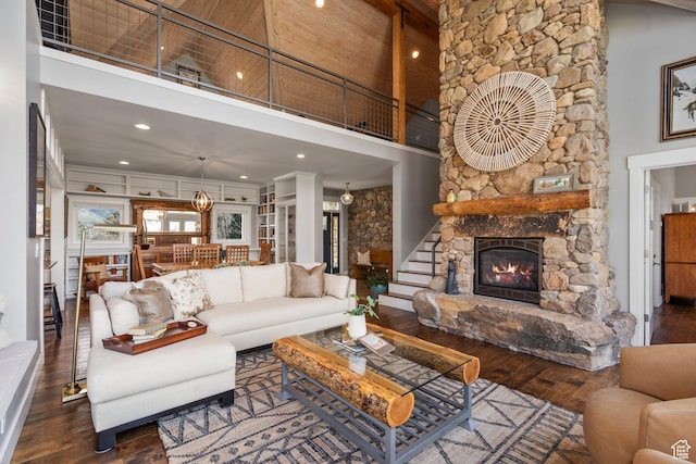 129 S 7200 E, Huntsville, UT 84317 - living room with a stone fireplace, recessed lighting, stairway, a towering ceiling, and wood-type flooring