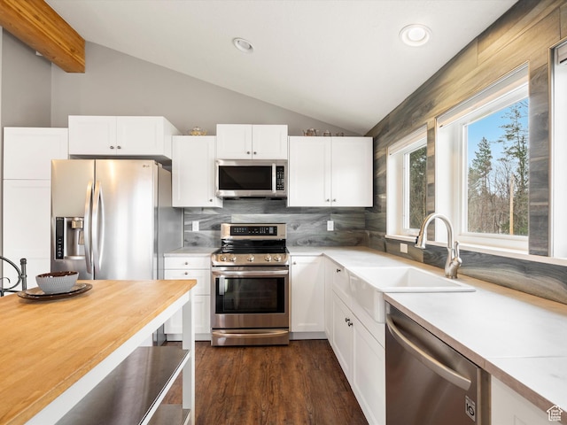 129 S 7200 E, Huntsville, UT 84317 - kitchen featuring a sink, light countertops, appliances with stainless steel finishes, white cabinetry, and vaulted ceiling