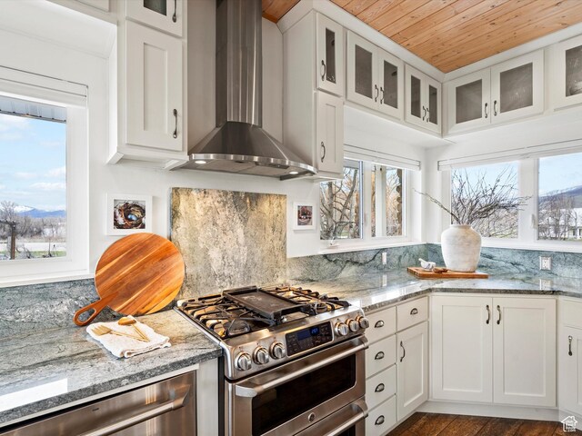 129 S 7200 E, Huntsville, UT 84317 - kitchen with wall chimney exhaust hood, glass insert cabinets, white cabinets, and stainless steel appliances