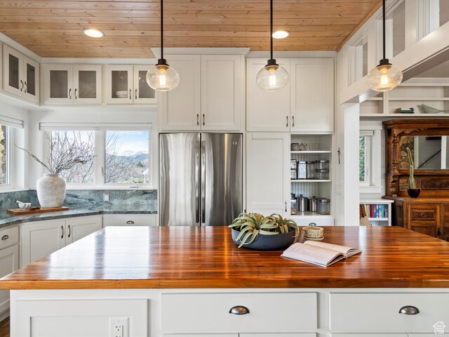 129 S 7200 E, Huntsville, UT 84317 - kitchen featuring wood counters, glass insert cabinets, freestanding refrigerator, white cabinets, and wooden ceiling