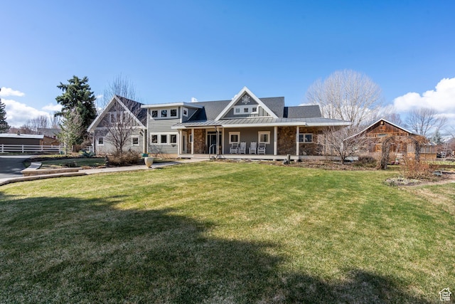 129 S 7200 E, Huntsville, UT 84317 - view of front of home with a standing seam roof, a front yard, metal roof, and covered porch