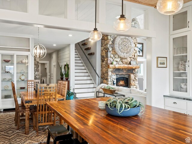 129 S 7200 E, Huntsville, UT 84317 - dining room featuring an inviting chandelier, a fireplace, recessed lighting, and stairs