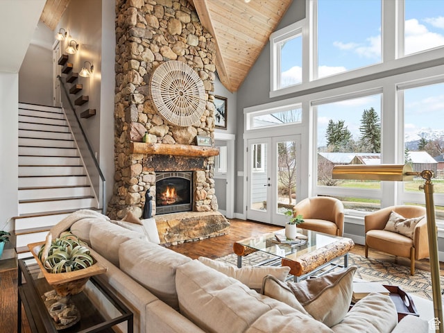 129 S 7200 E, Huntsville, UT 84317 - living room with high vaulted ceiling, a fireplace, stairway, wood ceiling, and wood finished floors