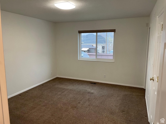 567 S Hazel Dr, Salem, UT 84653 - spare room with dark colored carpet and baseboards