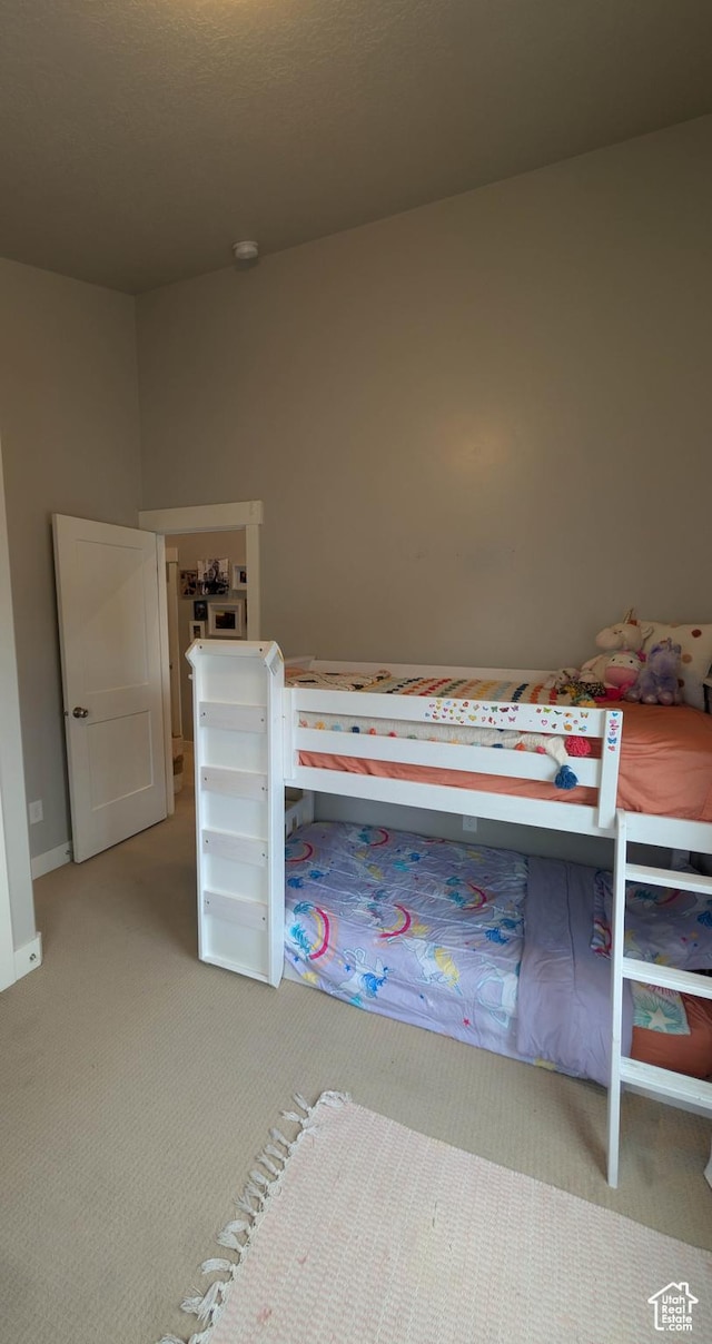 unfurnished bedroom featuring light colored carpet