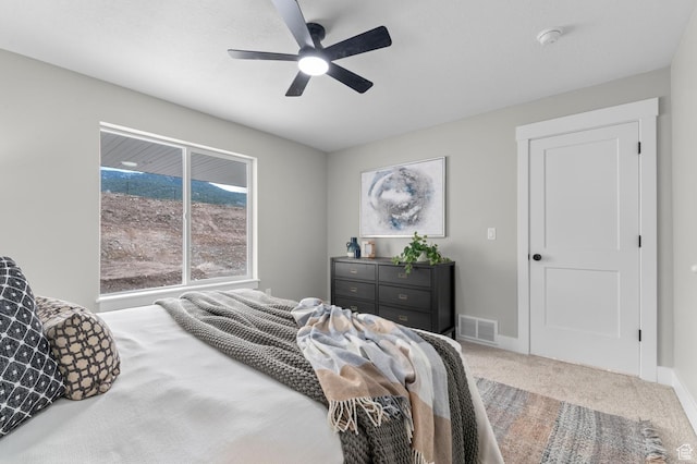 bedroom featuring ceiling fan, carpet flooring, baseboards, and visible vents