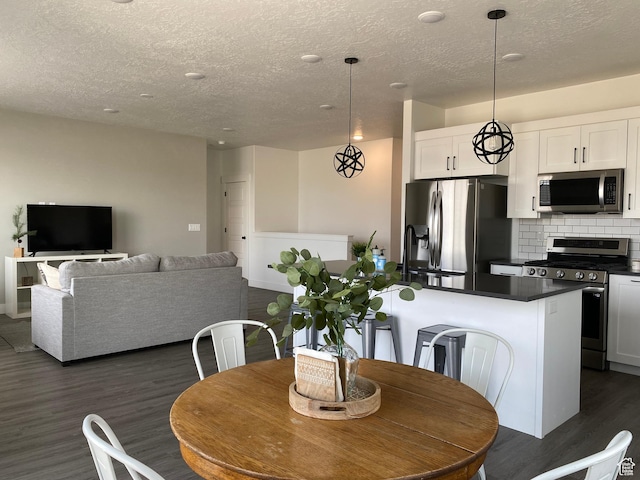 471 E 600 S, Hyrum, UT 84319 - dining room featuring a textured ceiling and dark wood-style flooring