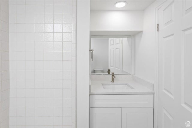 bathroom with toilet and vanity