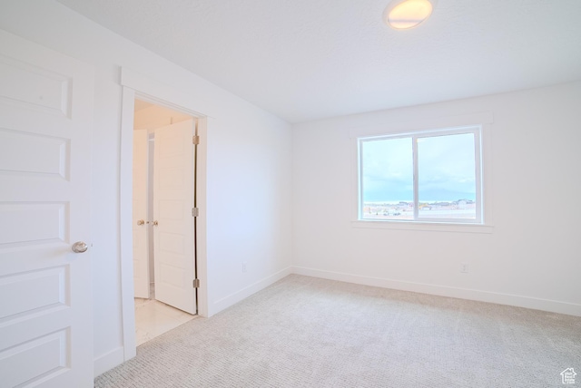 1258 S Boxelder Dr, Saratoga Springs, UT 84005 - spare room featuring light colored carpet and baseboards