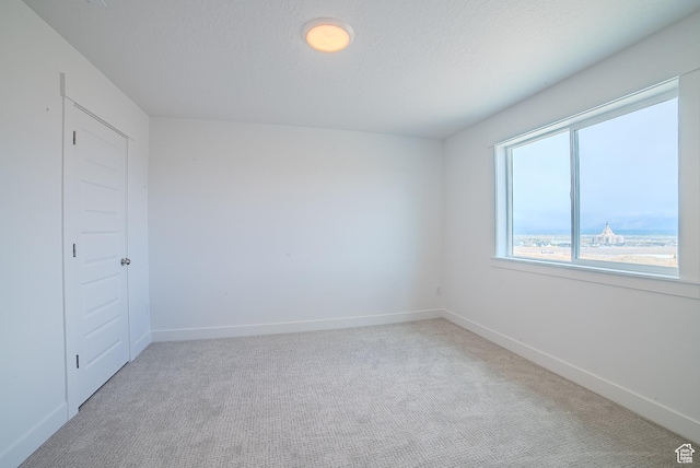 1258 S Boxelder Dr, Saratoga Springs, UT 84005 - empty room featuring light carpet and baseboards