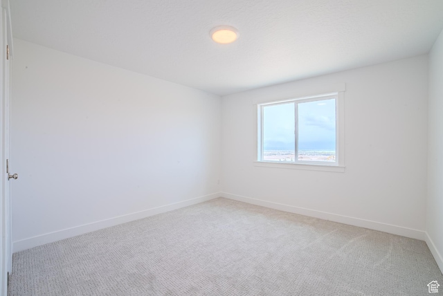 1258 S Boxelder Dr, Saratoga Springs, UT 84005 - spare room featuring light colored carpet and baseboards