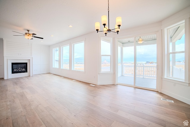 1258 S Boxelder Dr, Saratoga Springs, UT 84005 - unfurnished living room featuring a ceiling fan, a chandelier, baseboards, and recessed lighting