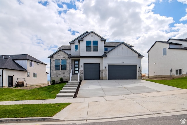 1258 S Boxelder Dr, Saratoga Springs, UT 84005 - craftsman house featuring board and batten siding, driveway, a front yard, and a garage