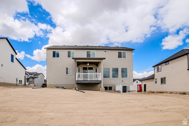 1258 S Boxelder Dr, Saratoga Springs, UT 84005 - rear view of house with stucco siding and a balcony