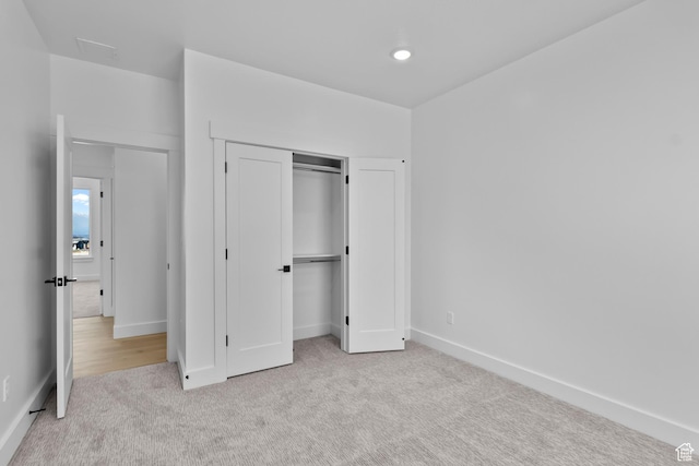 2961 N 2350 W Unit 107, Farr West, UT 84404 - unfurnished bedroom with baseboards, a closet, carpet floors, and recessed lighting
