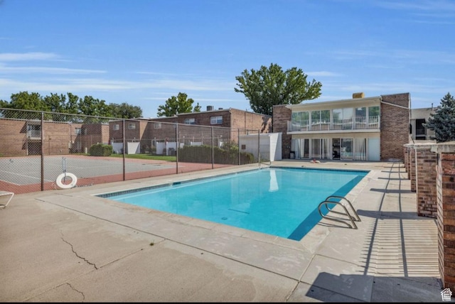825 E 3990 S Unit C, Millcreek, UT 84107 - view of pool featuring a fenced in pool, a patio area, and fence