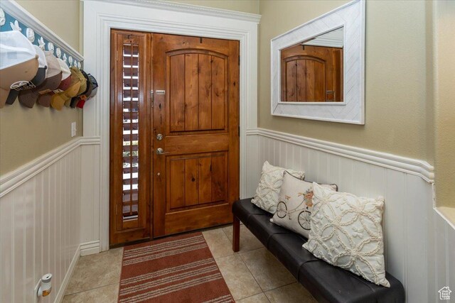 tiled foyer entrance with wainscoting