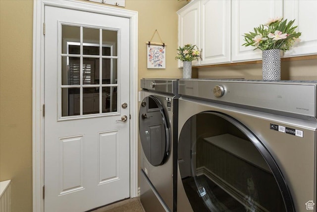laundry area featuring cabinet space and separate washer and dryer