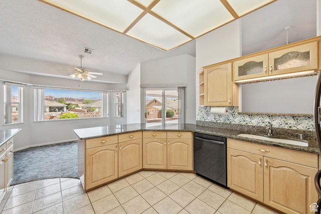 3546 Windmill Dr, Santa Clara, UT 84765 - kitchen with light brown cabinets, a sink, black dishwasher, and a peninsula