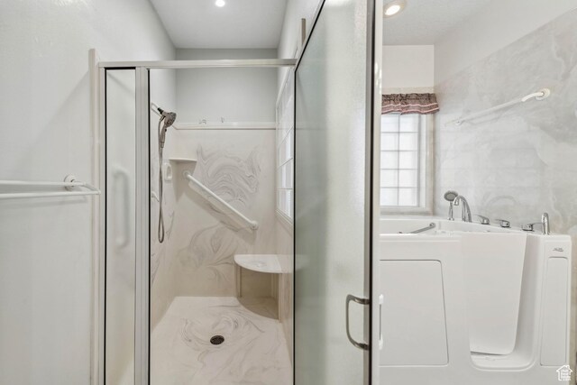 3546 Windmill Dr, Santa Clara, UT 84765 - full bathroom featuring a shower stall, washer / clothes dryer, recessed lighting, and a garden tub