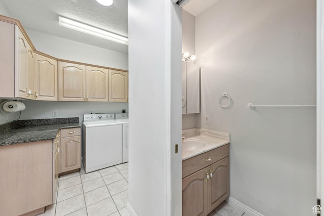 3546 Windmill Dr, Santa Clara, UT 84765 - interior space with a textured ceiling, baseboards, a sink, washer and clothes dryer, and light tile patterned floors