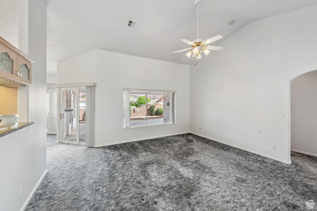 3546 Windmill Dr, Santa Clara, UT 84765 - unfurnished living room featuring carpet flooring, high vaulted ceiling, visible vents, baseboards, and ceiling fan