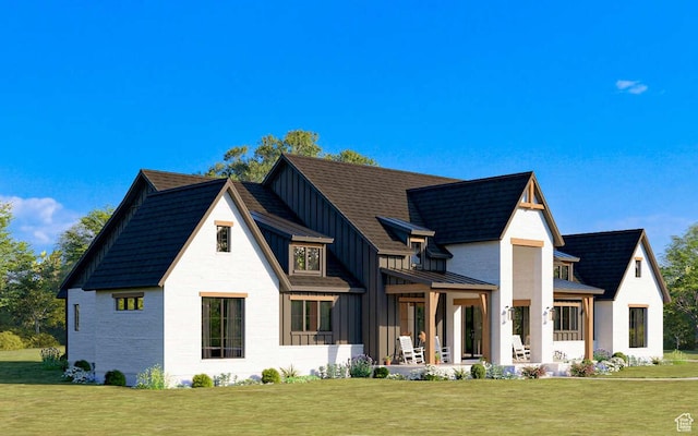back of house featuring a lawn, metal roof, a standing seam roof, and board and batten siding